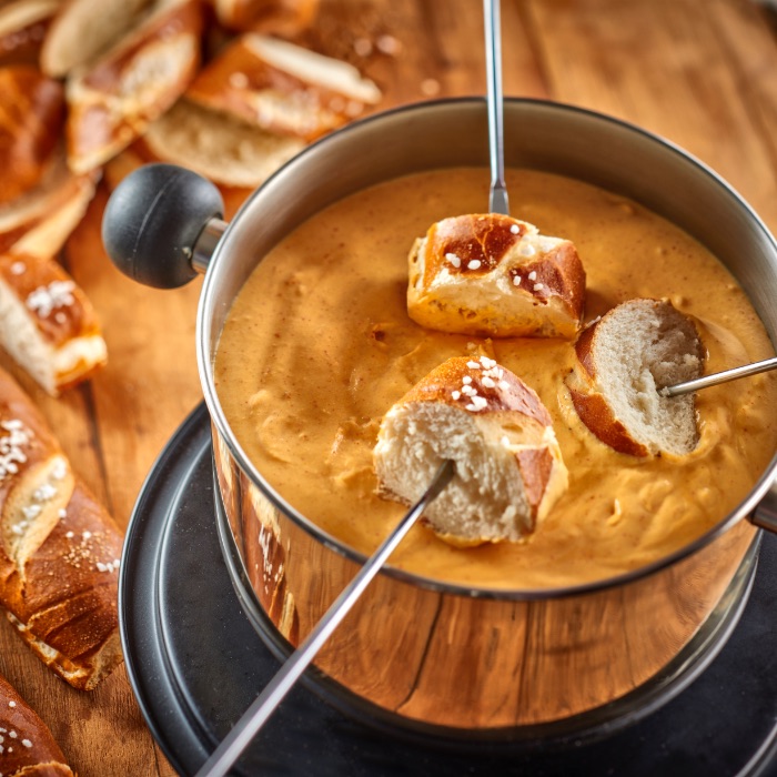 Cheesy Fondue Served with Pretzels Rich Products Corporation Africa